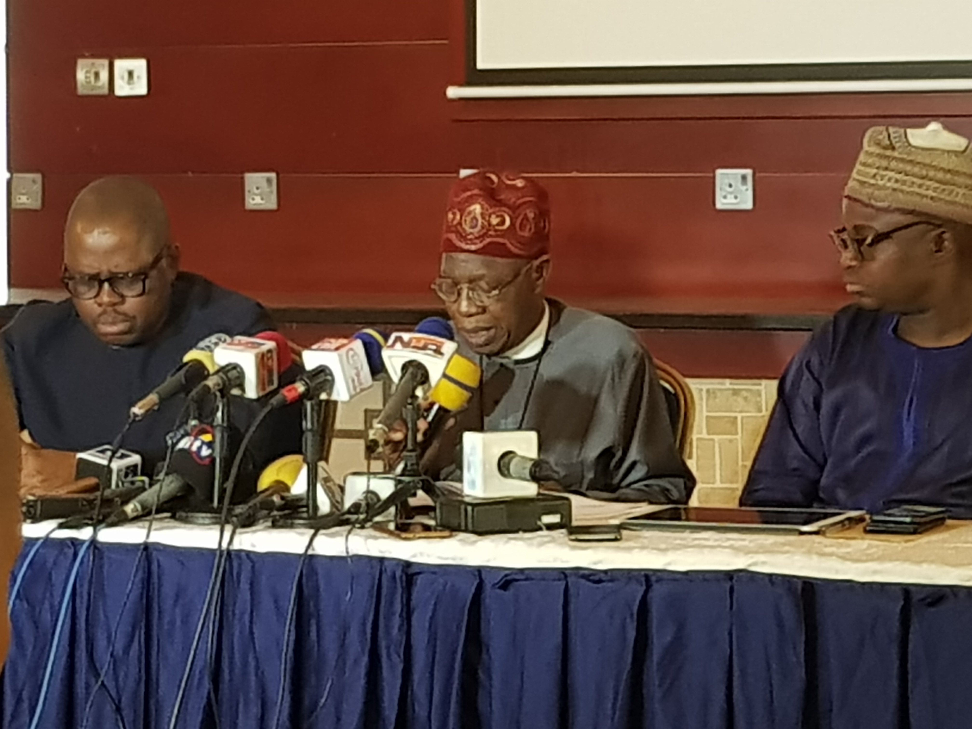 Alhaji Mohammed (Middle) presenting President Buhari's scorecard in Lagos today.