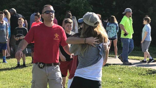 Terrified parents storm the school after the shooting.