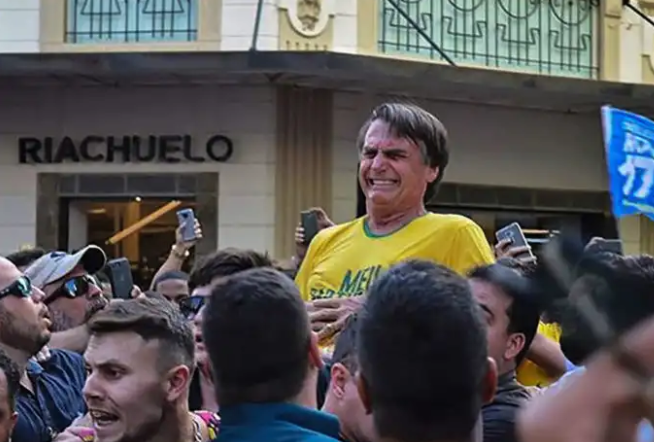 Jair Bolsonaro groaning after he was stabbed