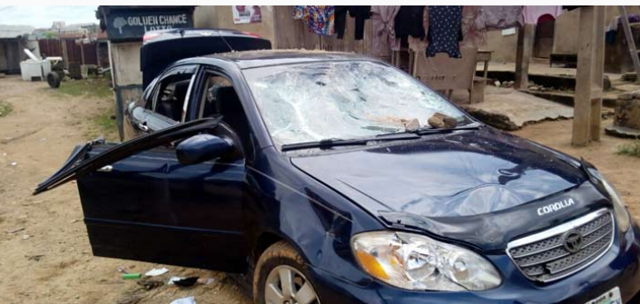 Fatai Oyedele's car allegedly vandalised by suspected APC supporters in Osogbo, today. Photo: The PUNCH