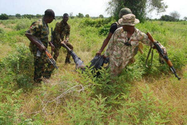 A file photo from NAN showing a Boko Haram terrorist retrieved from the bush by Nigerian troops