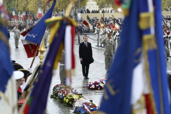 French President Emmanuel Macron at the Tomb of the Unknown Soldier at the Arc de Triomphe in Paris last year. France marks 100 years since end of World War 1