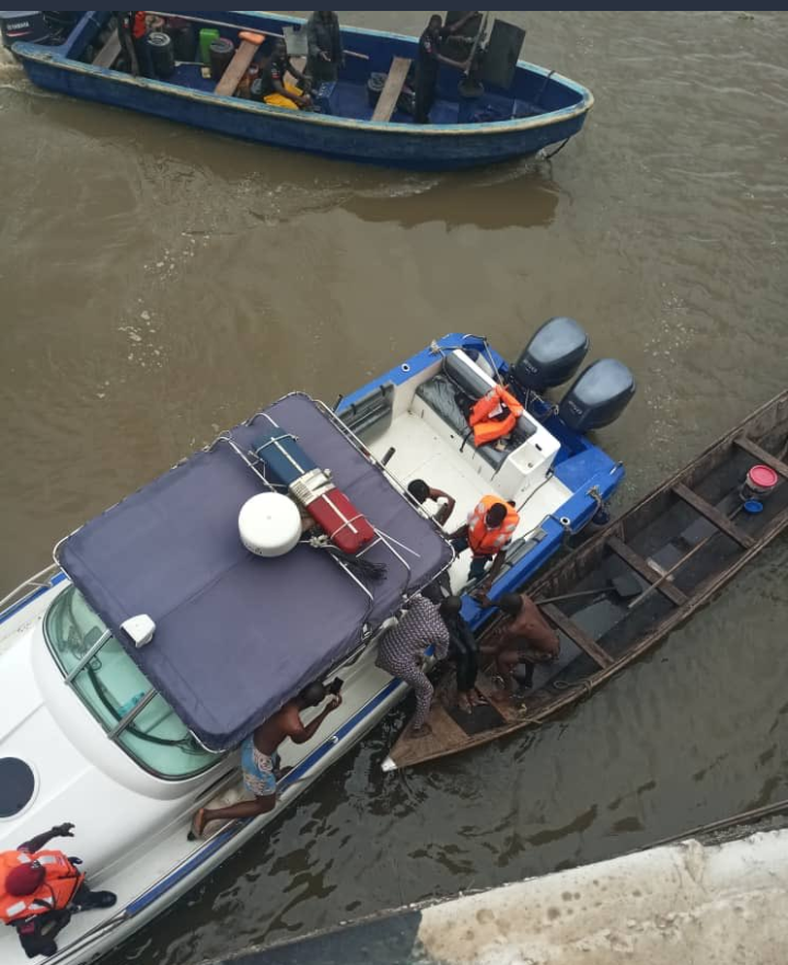 Rescuers fishing out the body a man who committed suicide by jumping into the lagoon on Friday