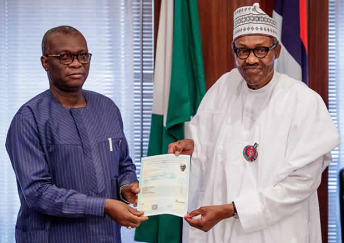 Buhari receiving his certificate from a representative of WAEC at the State House today
