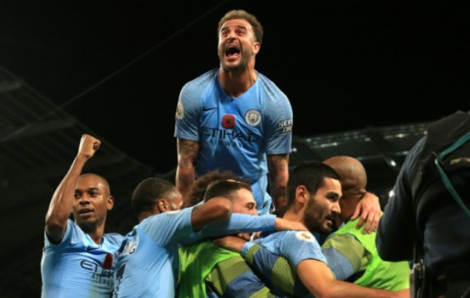 Man City players celebrate another victory over Man United in derby