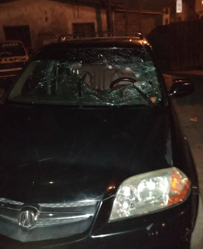 The woman's damaged car