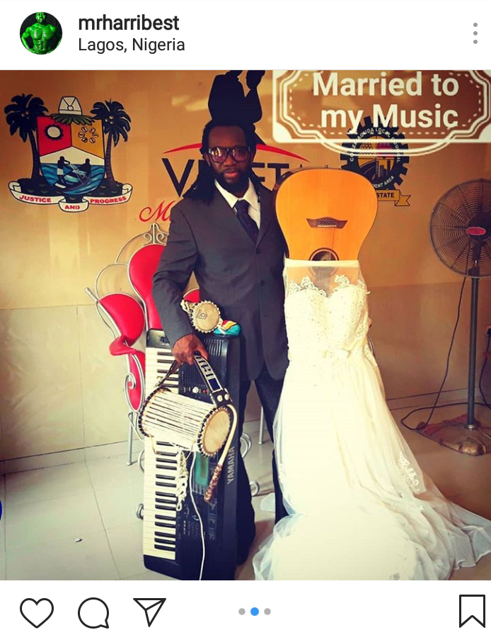 The groom and his guitar after the wedding