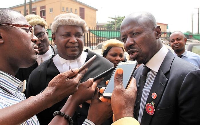 Magu , right, with his lawyer Wahab Shittu in Lagos today