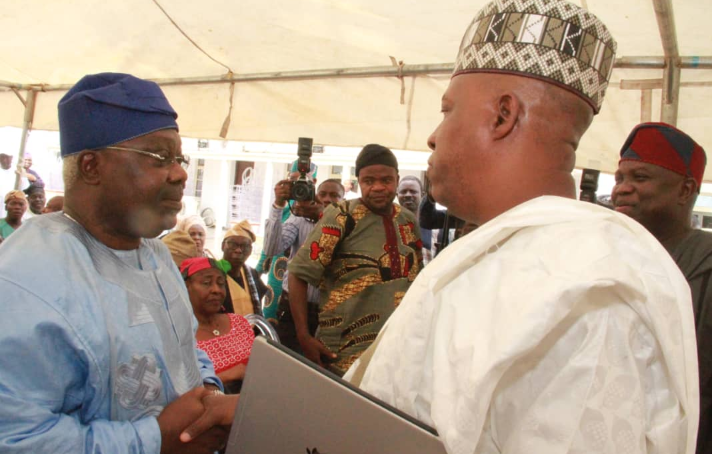 Omisore, left, exchanging pleasantries with Shettima and Ambode at the event.