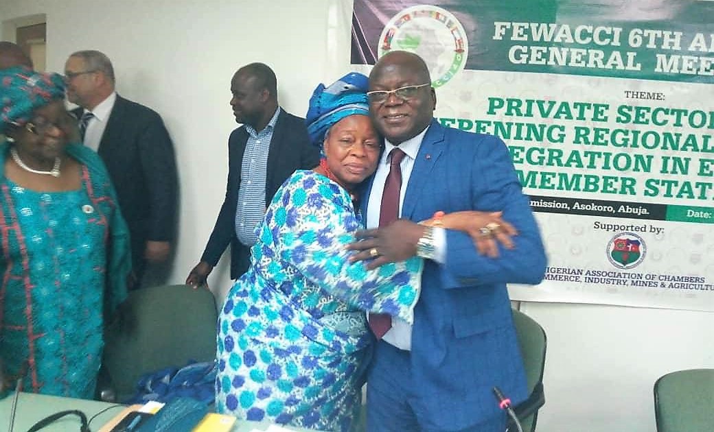 Iyalode Alaba Lawson, left, being congratulated by her predecessor, Mr Meba of Togo