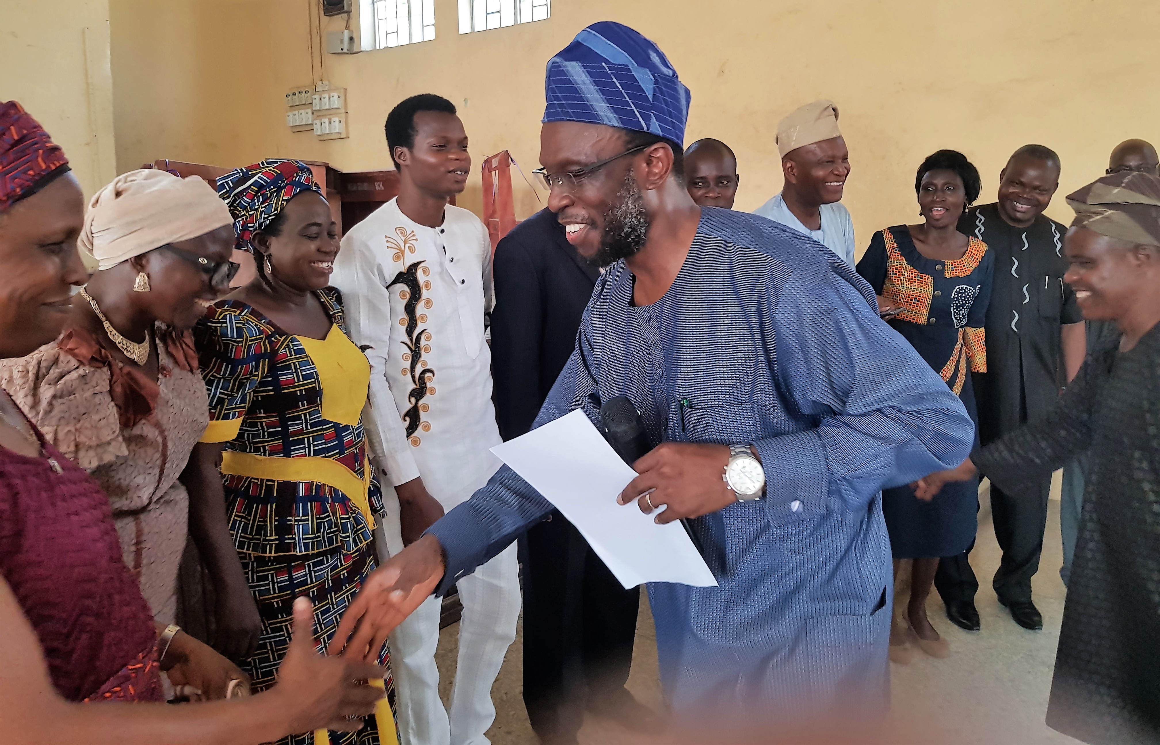 Prof Fagbohun and Prof Tella congratulating members of the new executive ushered in last year