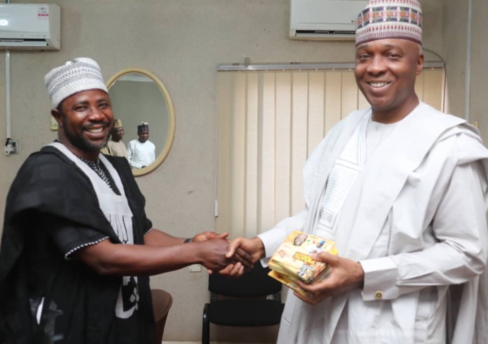 President of the Senate, Dr. Abubakar Bukola Saraki receiving campaign jingles from Alhaji Oluwanishola Onimalu in Ilorin, Kwara State, yesterday