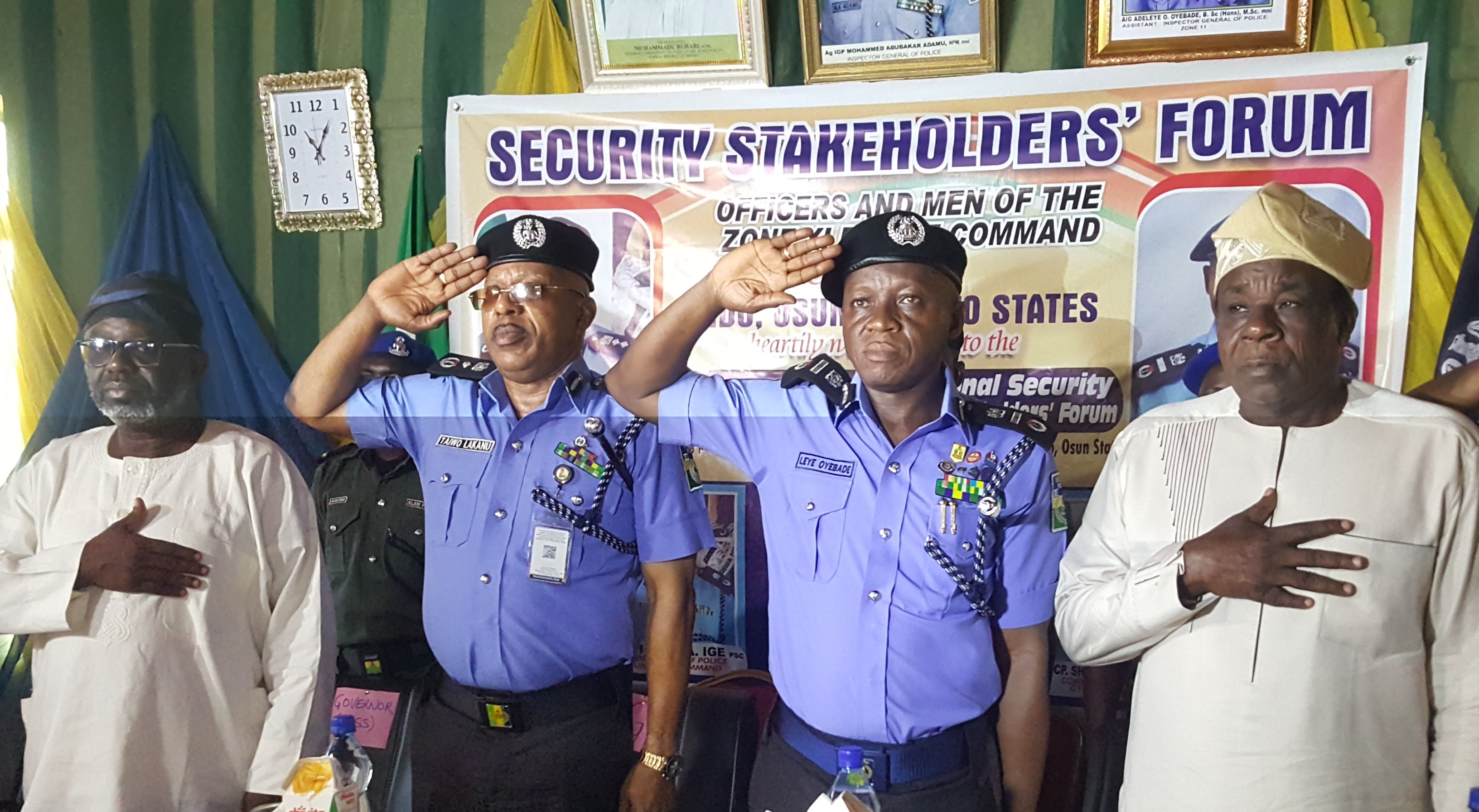 From Left: Governor Isiaka Oyetola of Osun State represented by the Secretary to the State Government, Prince Wole Oyebamiji, DIG Taiwo Lakanu representing acting IGP Adamu, AIG Leye Oyebade, and Oyo State deputy governor, Chief Moses Alake Adeyemo taking the National Anthem at the inauguration of the Zone XI Security Stakeholders' Forum in Osogbo on April 25, 2019.