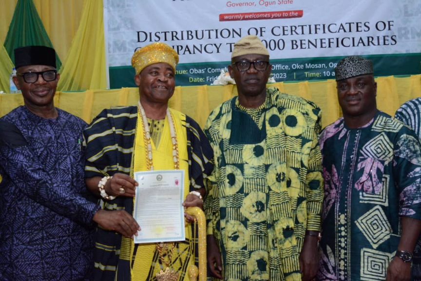 L-R: Director General, Bureau of Lands and Survey, Arc. Segun Fowora; first receipient of the Ogun State Land Administration and Revenue Management System (OLARMS) and the Olu of Itori, Abdul-Fatai Akamo; representative of the Ogun State Governor and Secretary to the State Government (SSG), Mr. Tokunbo Talabi and the Commissioner for Housing, Hon. Jagunmolu Akande Omoniyi, during the distribution of 5,000 Certificates of Occupancy to beneficiaries at the Oba's Complex, Oke-Mosan, Abeokuta, on Friday.