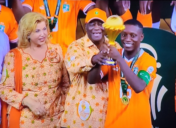 President Alassane Ouattara with Max-Alain Gradel lift 2024 AFCON trophy